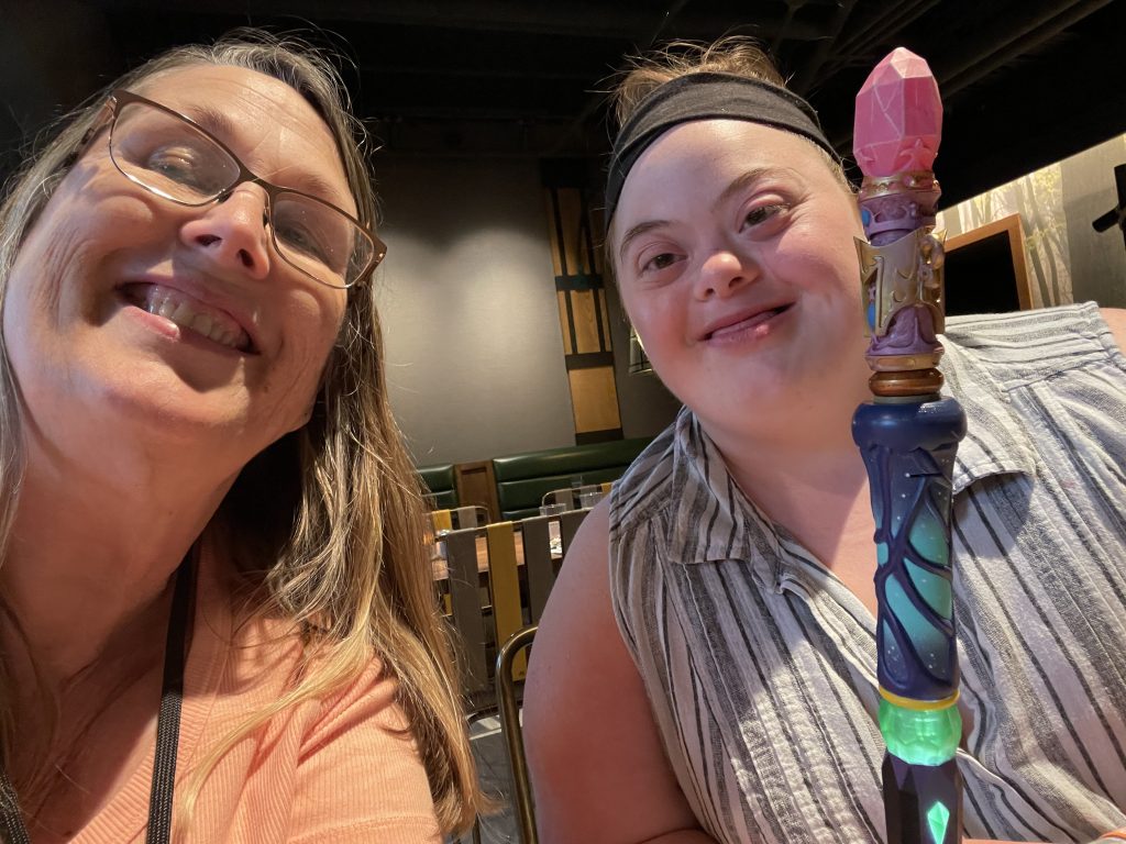 Down Syndrome Regression Disorder 2 A mother and daughter smile at the camera together.